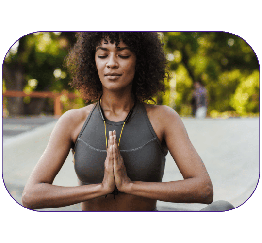 Woman meditating, experiencing peace of mind.